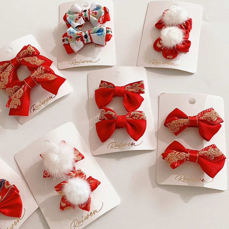 Bộ 2 kẹp tóc màu đỏ xinh xắn nhiều kiểu dáng làm quà tặng mừng năm mới cho bé gái