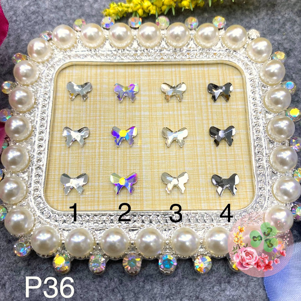 2 viên - Màu P36. Đá khối chân bằng siêu bắt sáng, đính dán móng.