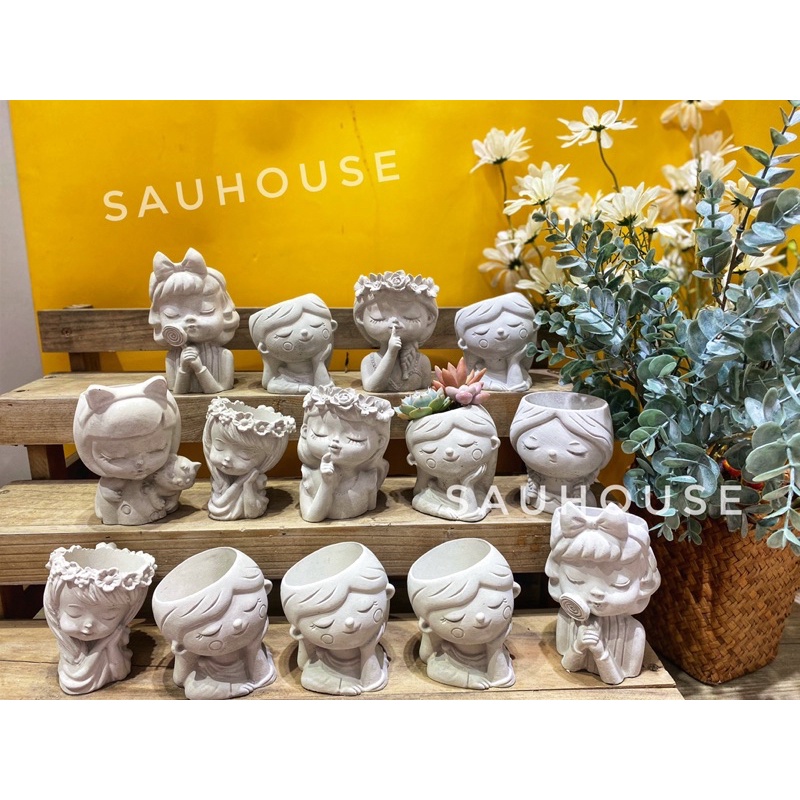 Chậu xi măng cô gái trồng sen đá