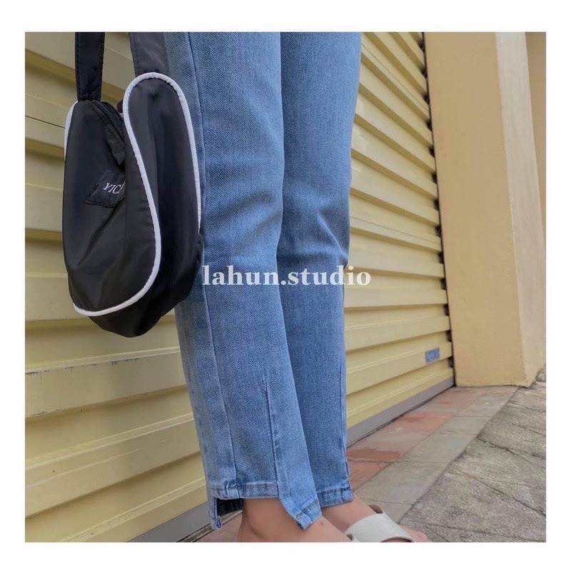 Quần jeans suông gấu lệch cạp cao co dãn