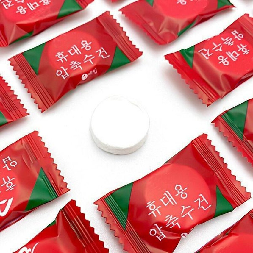 Khăn lau mặt nén cotton hình tròn không mùi dùng một lần, khăn khô nén viên kẹo đỏ Hàn Quốc Túi 20 viên Angola