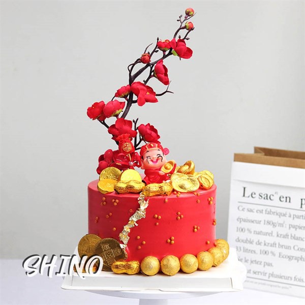 Thần tài ôm thỏi vàng một bên