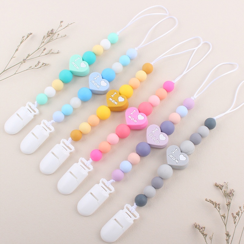 Kẹp Núm Vú Giả Ngậm Mọc Răng Bằng Silicone Đính Hạt Trái Tim In Chữ I Love Mom Dad Dành Cho Bé Sơ Sinh