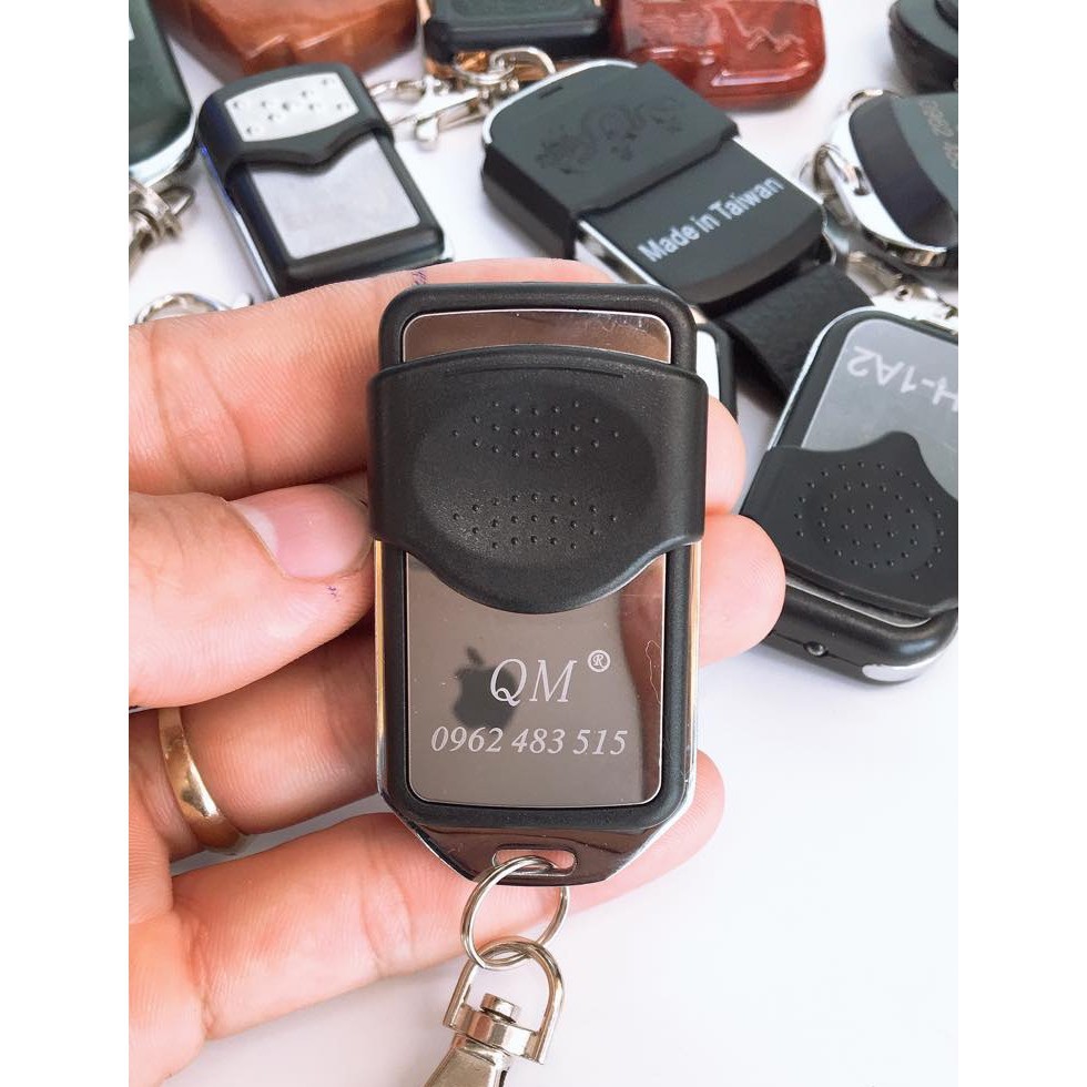 Điều khiển cửa cuốn cao cấp inox mã gạt tần sóng 433mhz chính hãng