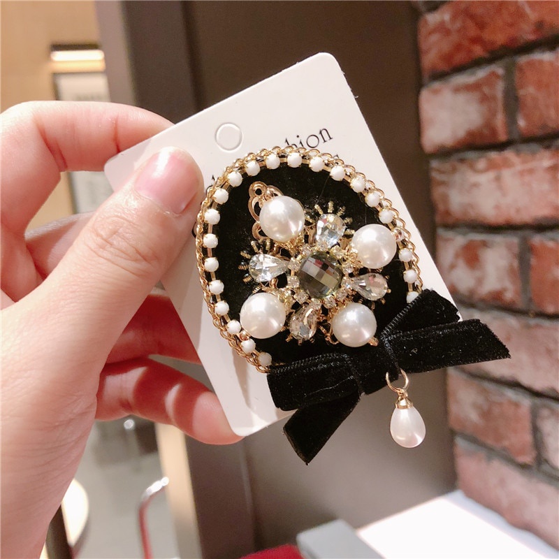 Trâm cài áo hình nơ đính ngọc trai sang trọng cho nữ