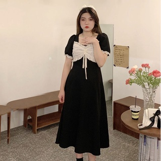 A small black dress with a fat and large size to cover the belly