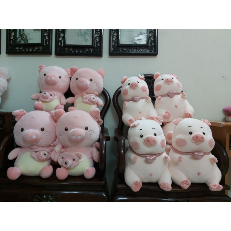 Lợn- heo đeo máy ảnh nhồi bông