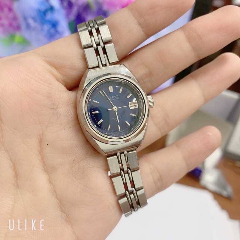 Đồng hồ si nữ hiệu Seiko, cơ tự động , mặt xanh, có lịch ngày