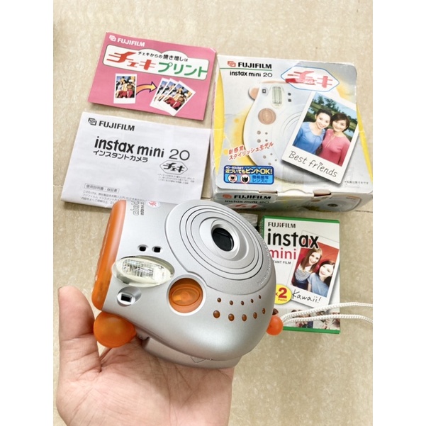 Máy chụp ảnh lấy liền Fujifilm Instax Mini 20 Cheki , tặng hộp film 10 tấm, tặng Pin CR2, tặng dây đeo