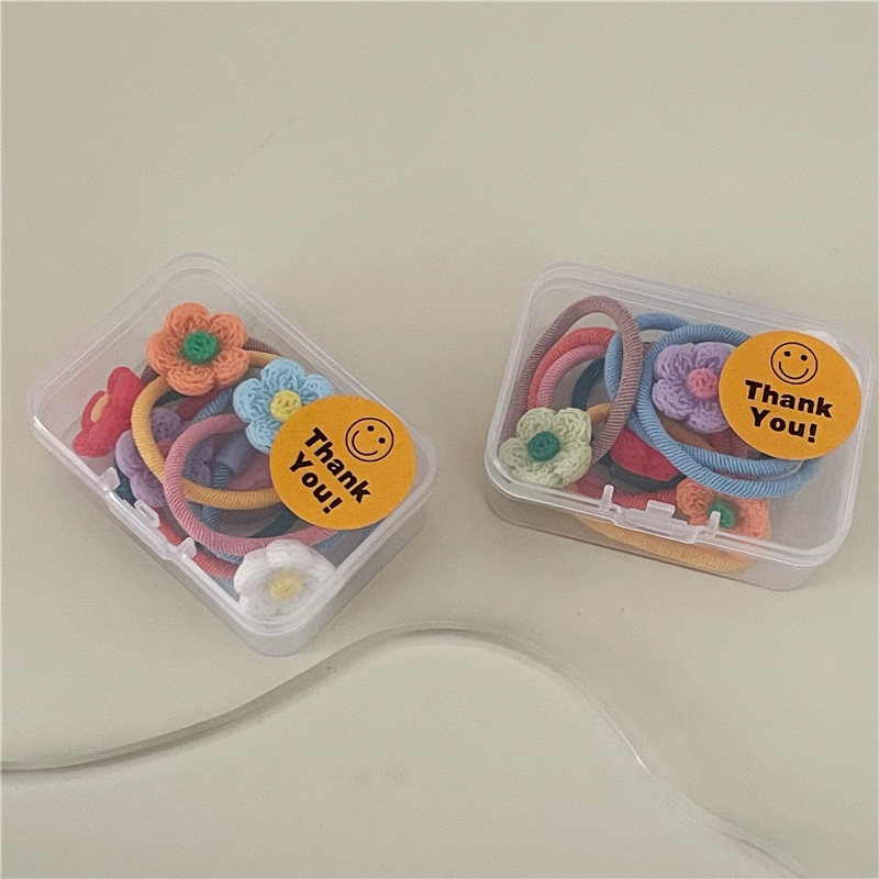 Hộp 7 chiếc cột tóc hoa nhựa nhiều màu cho bé