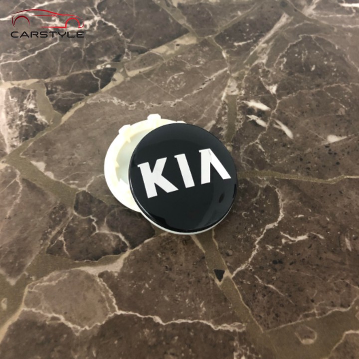 Logo chụp mâm bánh xe ô tô Kia 58mm màu đen và bạc K2 K5