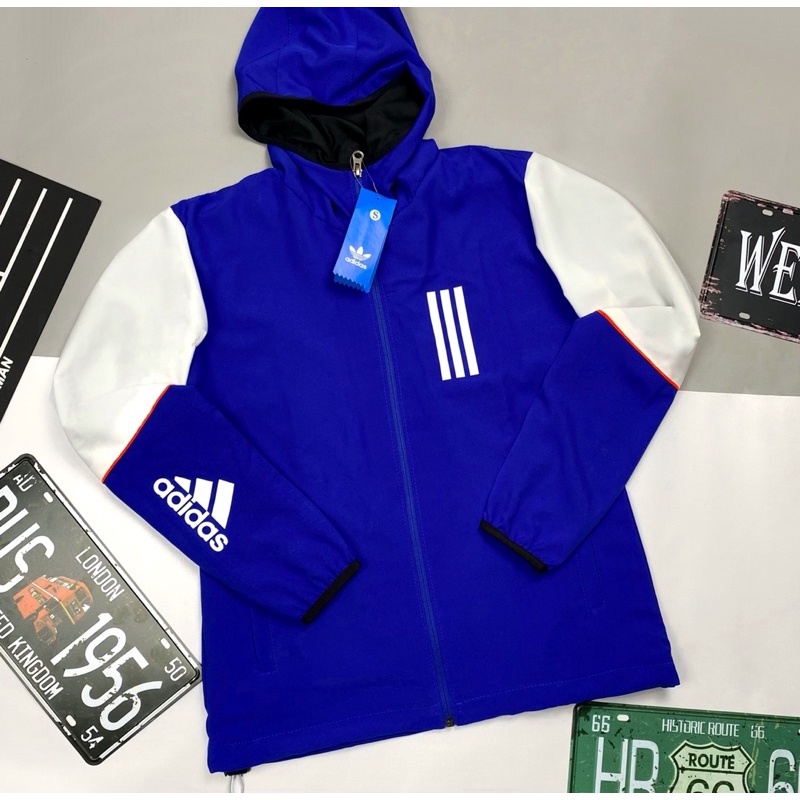 Áo Khoác Gió Nhẹ Nam Nữ 2 Lớp Có Mũ Chống Nắng Màu Xanh Trắng ADIDAS Thể Thao - Áo Khoác Dù Nam Nữ Form Xuông Có Dây Rút