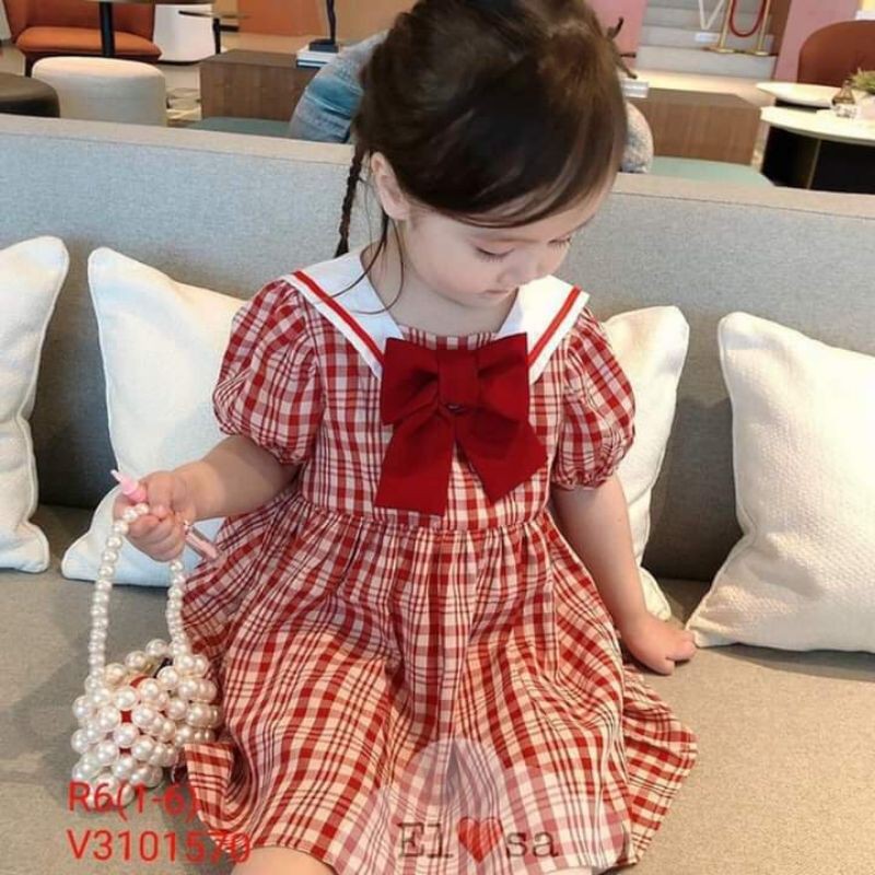 Váy nơ caro xinh cho bé