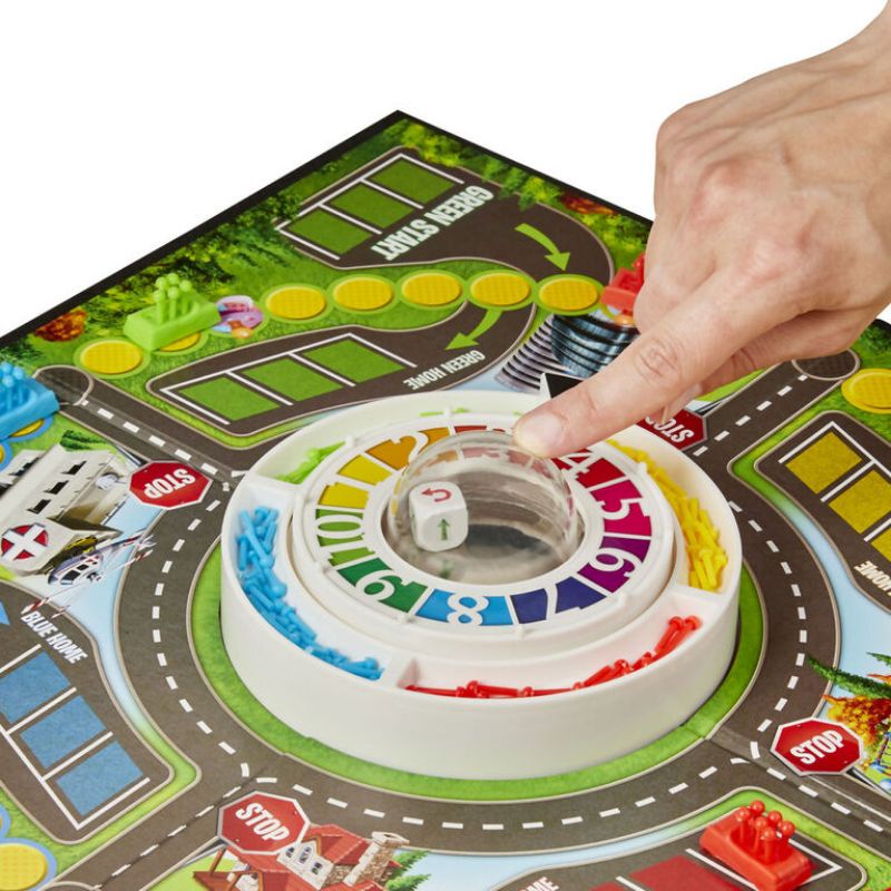 Trò chơi The Game of Life phiên bản con quay Pop o Matic Trouble game của Hasbro Game