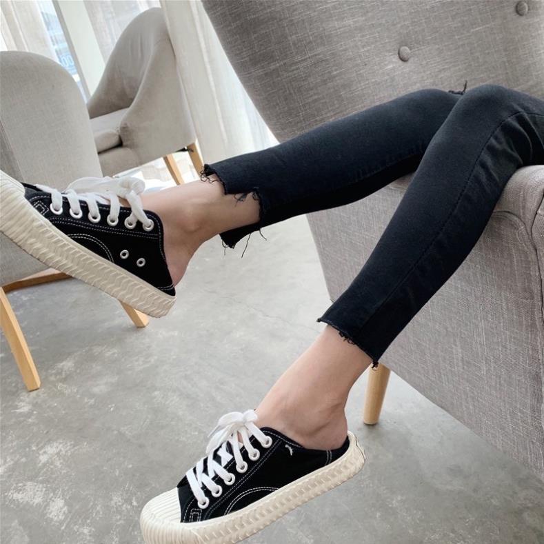 Quần jeans đen lưng cao rách gối tua gấu