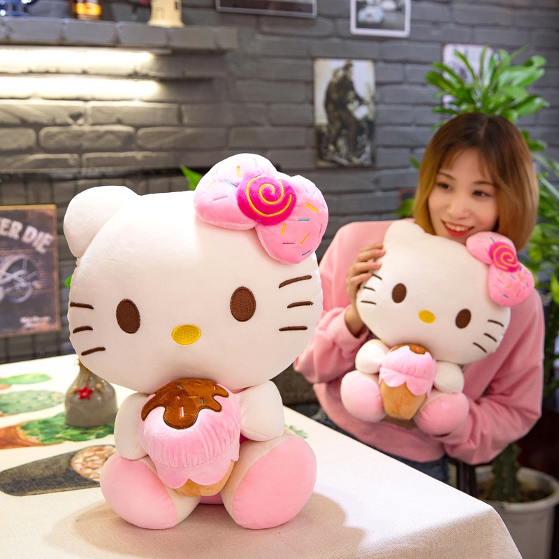 Gấu bông Hello Kitty ôm bánh đeo nơ dễ thương cho bé kích thước 30-40-50cm NEOCI