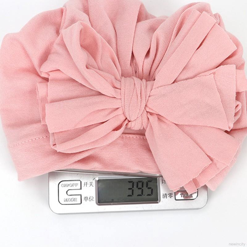 Mũ trùm đầu co dãn có chi tiết nơ mềm mại cho bé