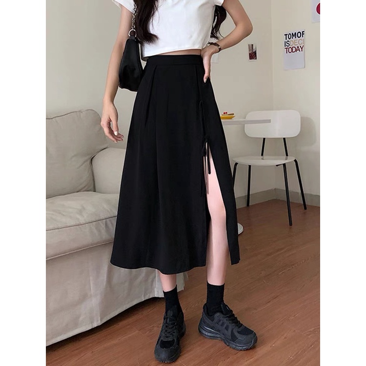 Chân váy nữ xẻ tà có dây buộc nơ ngay eo, chân váy midi qua gối cá tính Okélla