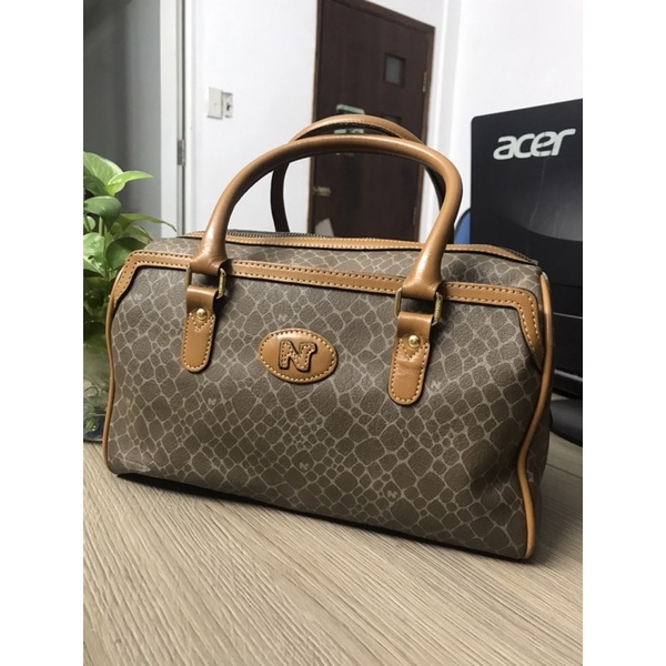Túi da công sở dáng trống Nina Ricci - used bags