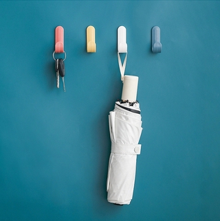 Convenient J-shaped towel rack