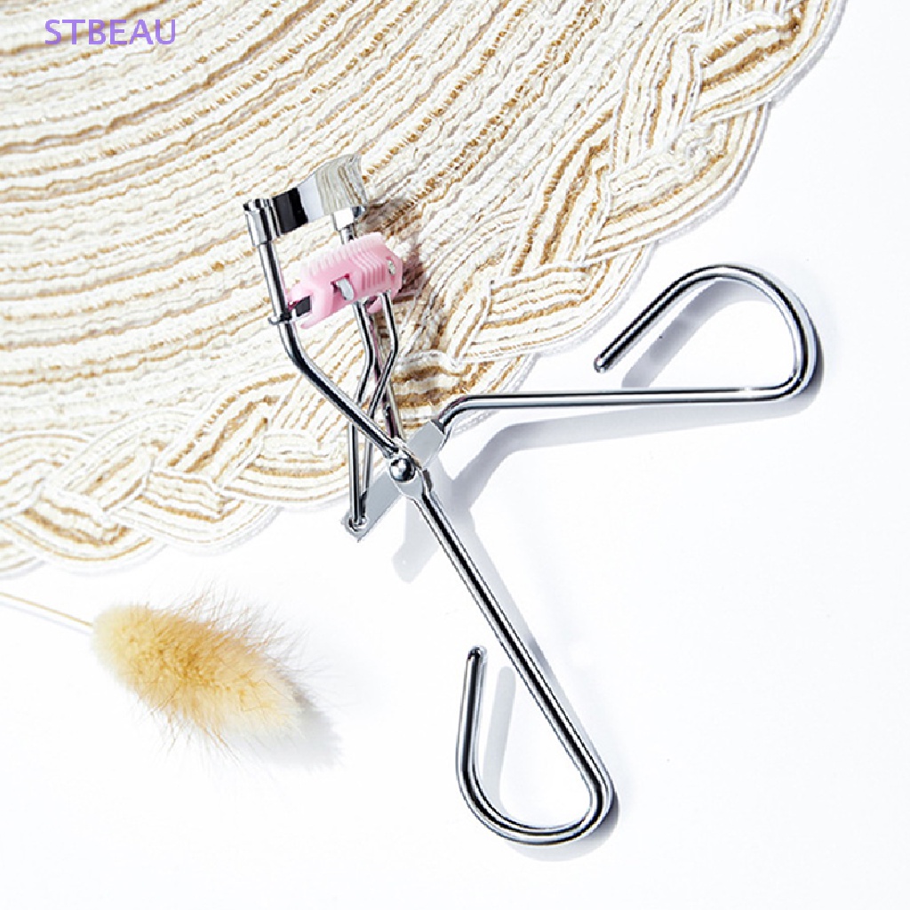 1 Dụng Cụ Bấm Cong Mi Tích Hợp Lược Tiện Dụng