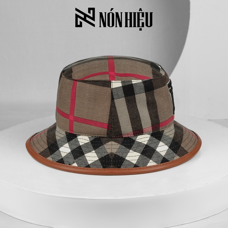 Mũ lưỡi trai - Nón Bucket phối viền da hoạ tiết Burberry MADE IN BANGLADESH Full Tem Mark hãng