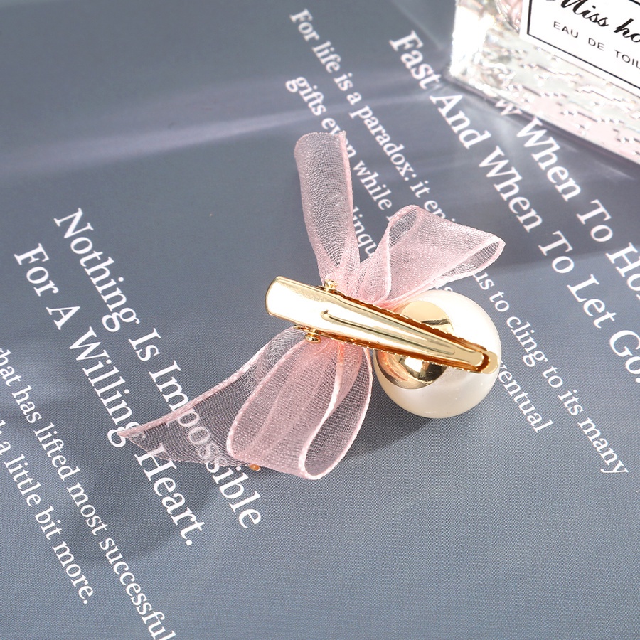 Kẹp tóc hình nơ đính ngọc trai xinh xắn dành cho nữ