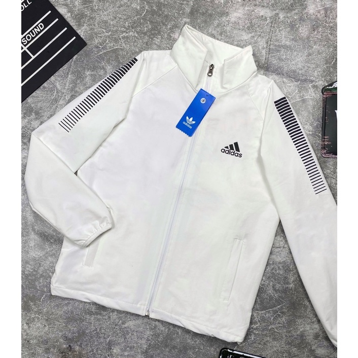 Áo Khoác Gió Nhẹ Nam Nữ 2 Lớp Chống Nắng Màu Trắng Tay Sọc Phản Quang ADIDAS Thể Thao Áo Khoác Dù Nam Nữ Line Có Dây Rút