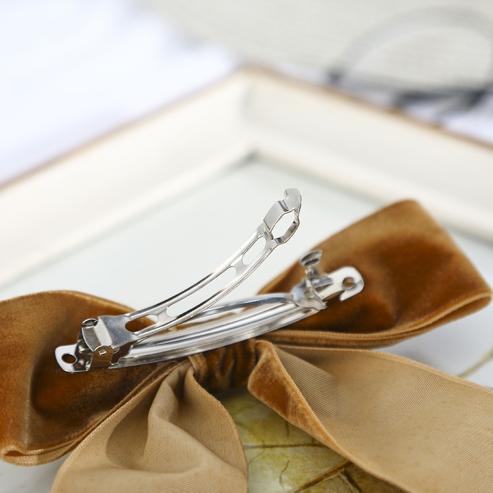 Kẹp tóc Haimeikang gắn nơ đính ngọc trai bằng