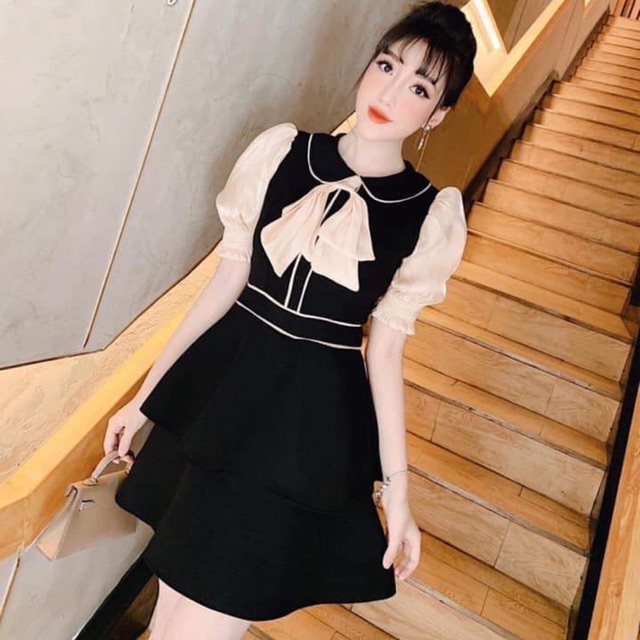 Đầm xoè tầng nơ tay con
