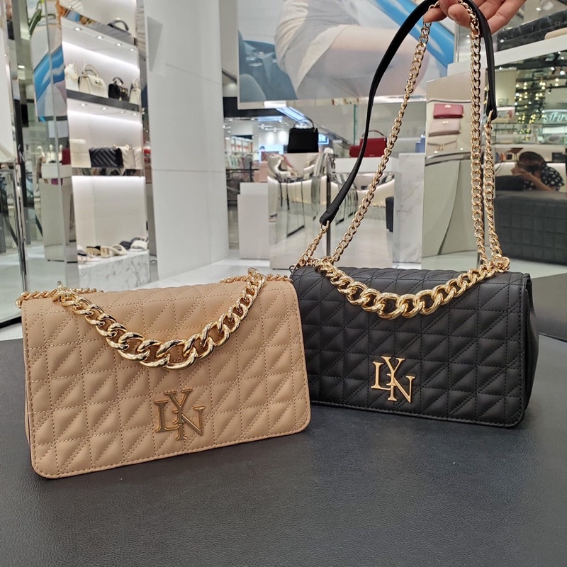 Túi lyn huy hiệu ô trám