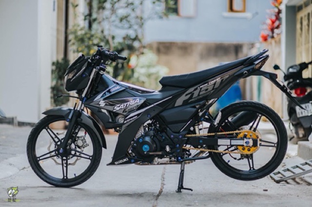 Gác chân trước satria Raider