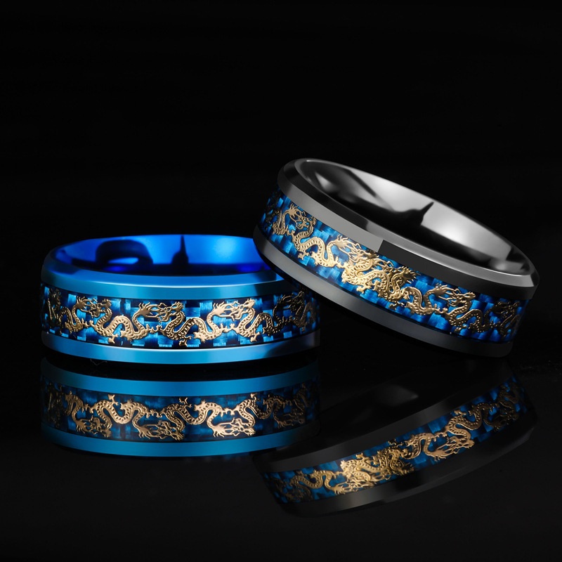 Kim loại: Carbide vonframƯu điểm: Chống xước và xỉn màuPhong cách: Ban nhạcGiới tính: Nam / NữMàu: Đen, XanhInlay: Rồng vàngKích thước US: 6 7 8 9 10 11 12 13Note: Các sản phẩm có chất liệu vàng, kim cương, đá quý trong shop đều là xi mạ/ nhân tạo.