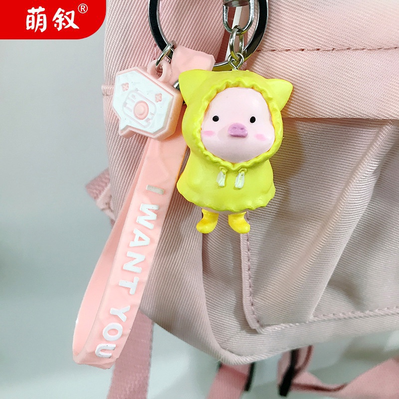 Hoạt Hình Móc Khóa Nhựa Hình Chú Heo Mặc Áo Mưa Dễ Thương