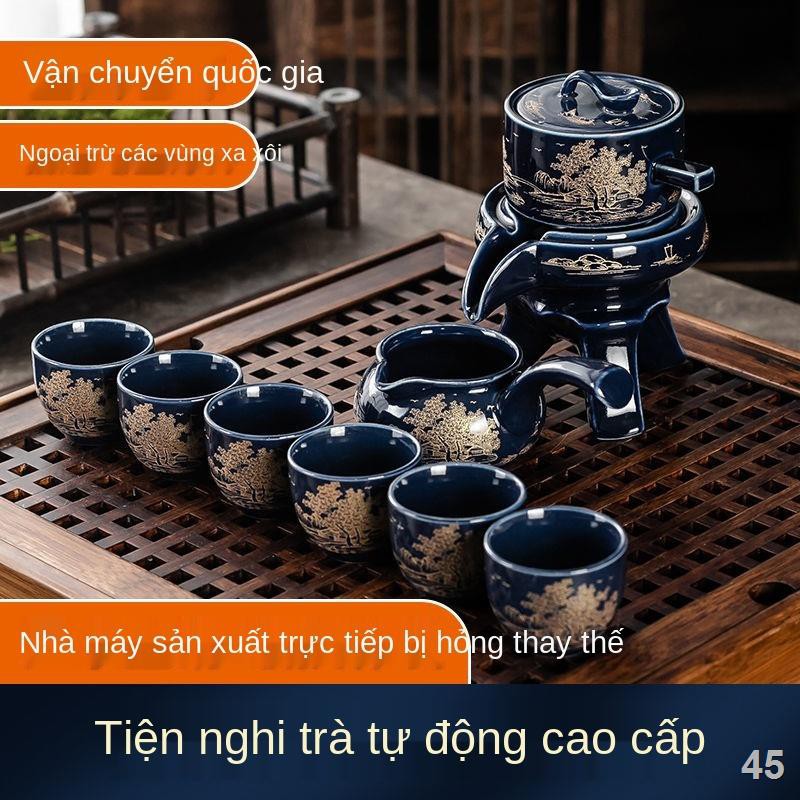 ZĐặc biệt cối xay đá men ngọc tự động xoay nước tự động Bộ trà kungfu cát tím Bộ ấm trà ấm trà gốm sứ