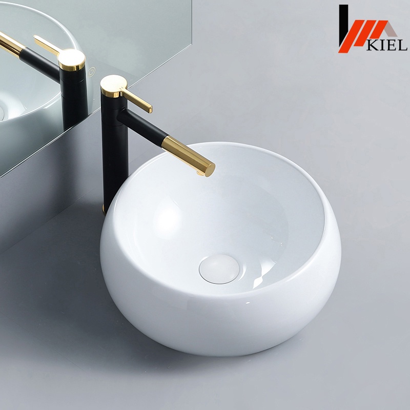 Chậu lavabo đặt bàn đá tròn cao cấp với thiết kế dáng tròn cách điệu mới lạ đặt nổi trên bàn .