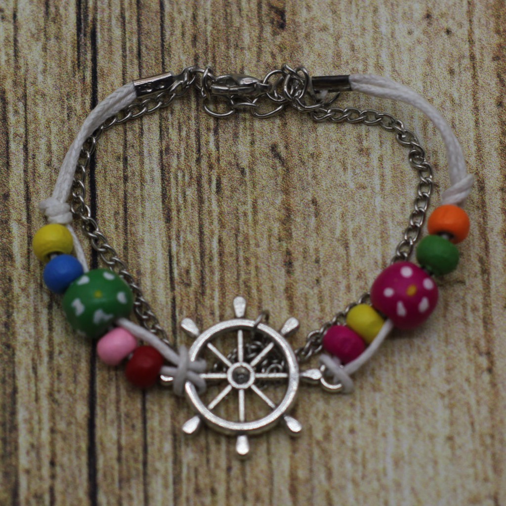 VT49 Vòng tay hạt gỗ mix charm 5 cái/lốc