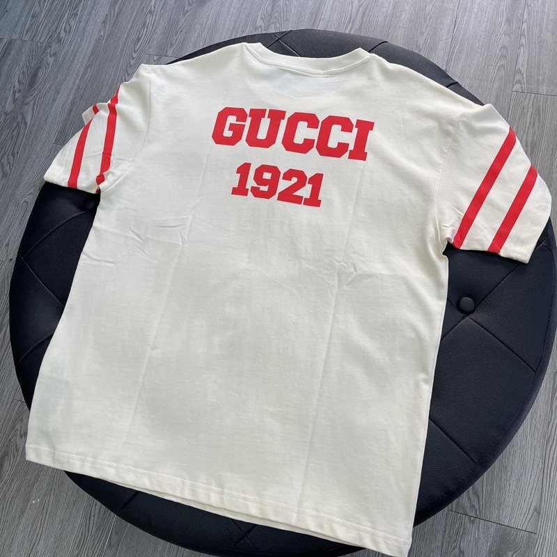 Áo Tee Gu*cci 100 Music Is Mine Màu Off-White