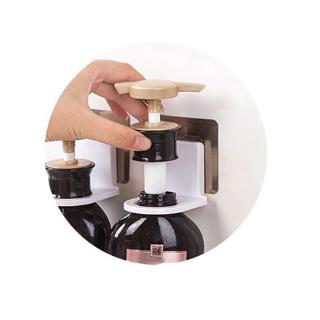 A space-saving multi-purpose kitchen / bathroom wall-mounted bottle holder