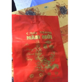 Túi nilon đỏ in chúc mừng năm mới loại dẻo dày( Giá 1kg)