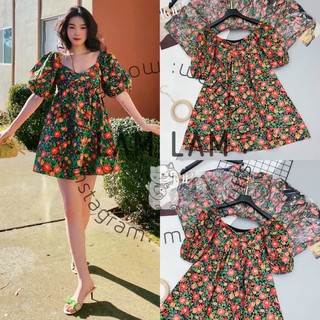 Đầm hoa xoè nơ tay bồng