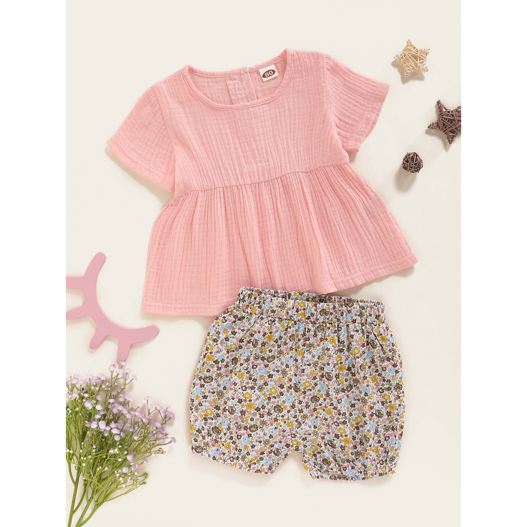 Bộ đồ 2 mảnh MIKRDOO gồm áo tay cộc màu hồng và quần hoa chất liệu vải cotton dành cho bé gái