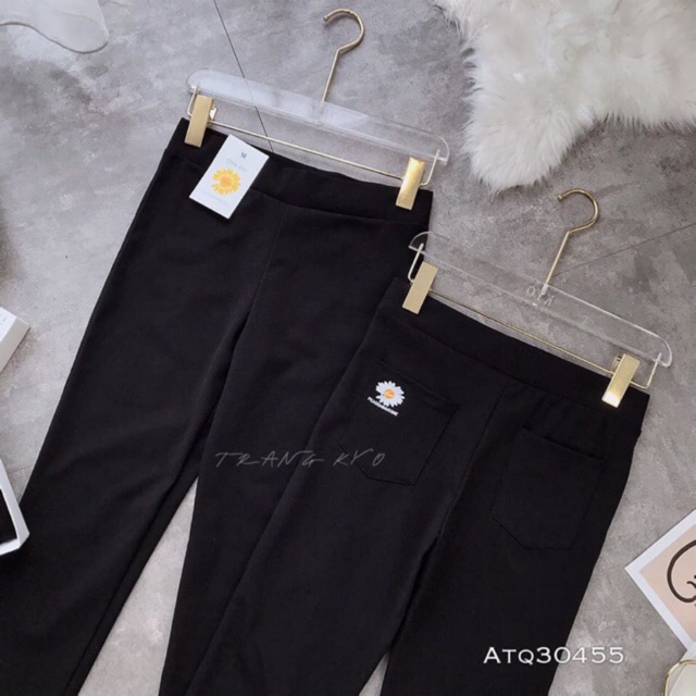 Quần legging in hoa cúc vàng