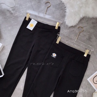 Quần legging in hoa cúc vàng
