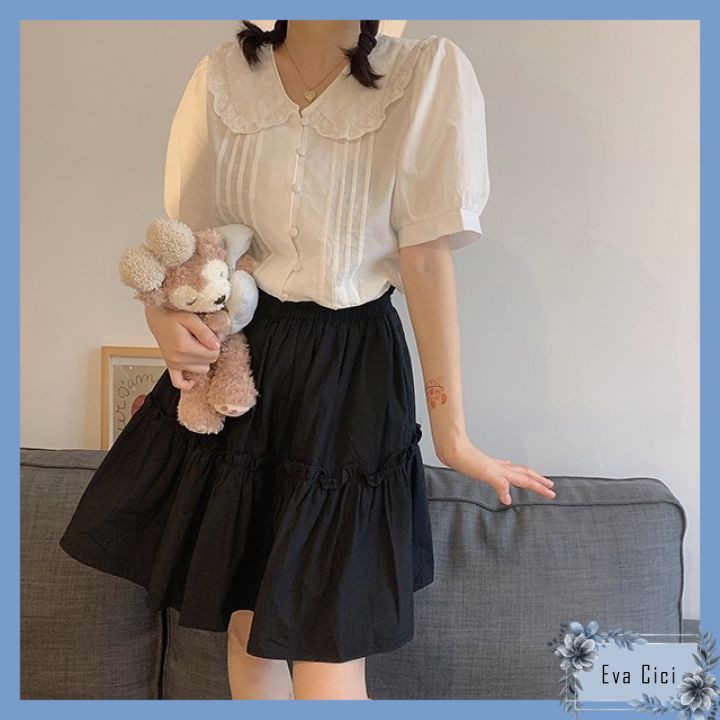 Áo sơ mi nữ trắng cộc tay bồng dáng babydoll. Áo sơ mi trắng cúc bọc cổ sen viền ren cộc tay.