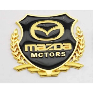Bộ 2 logo bông lúa chất liệu hợp kim đồng hãng xe MAZDA