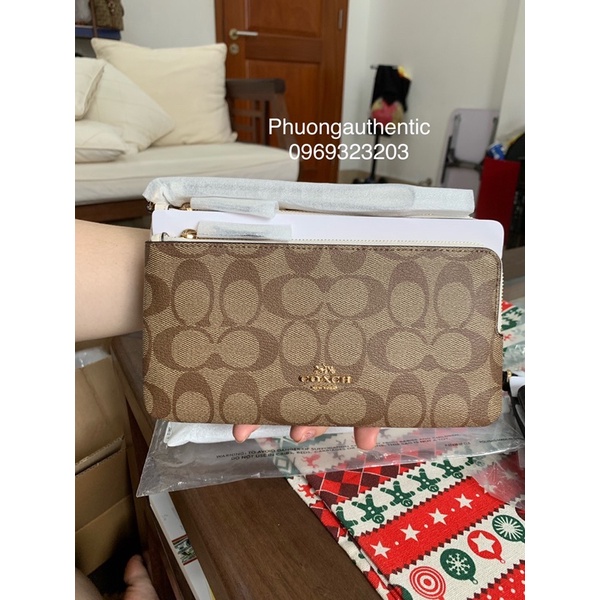 Ví cầm tay Coach logo signature canvas AUTHENTIC