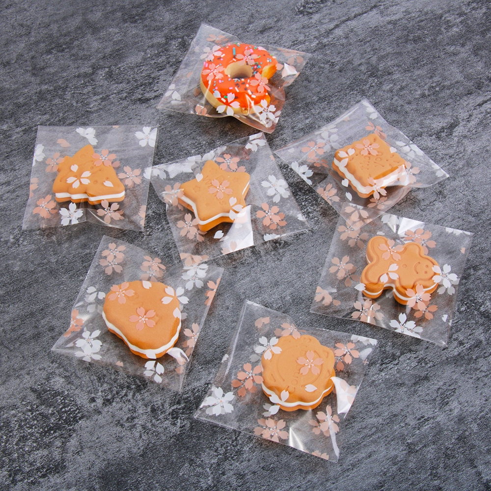 Set 100 túi nhựa dán đựng kẹo in hoa xinh xắn