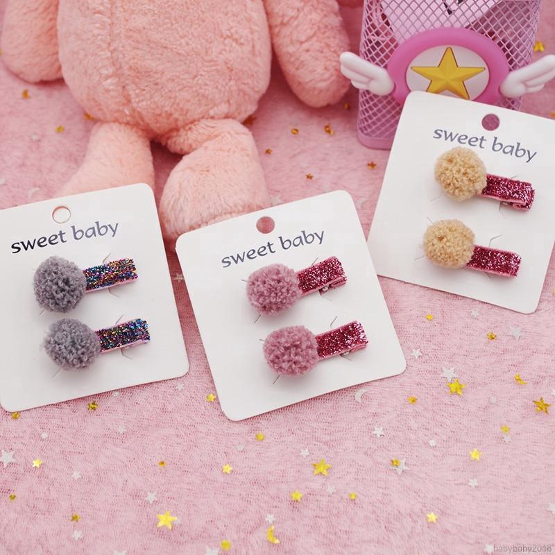 Set 2 kẹp tóc gắn quả cầu lông xinh xắn thời trang cho bé gái
