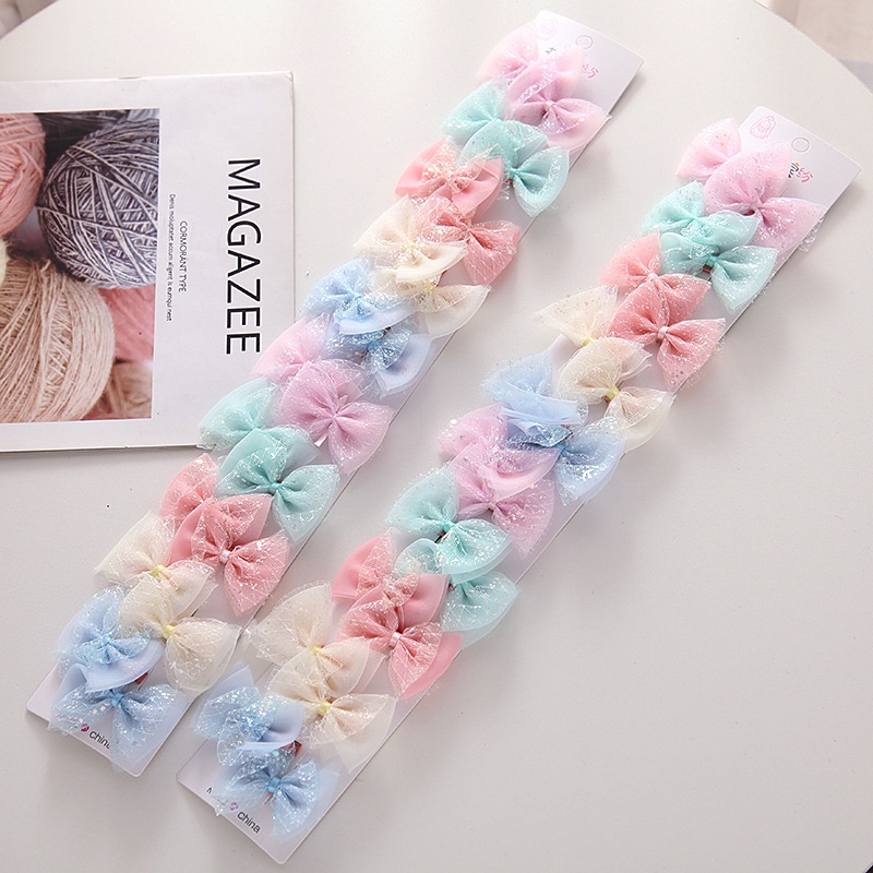 Kẹp tóc cho bé kiểu nơ hoạt hình